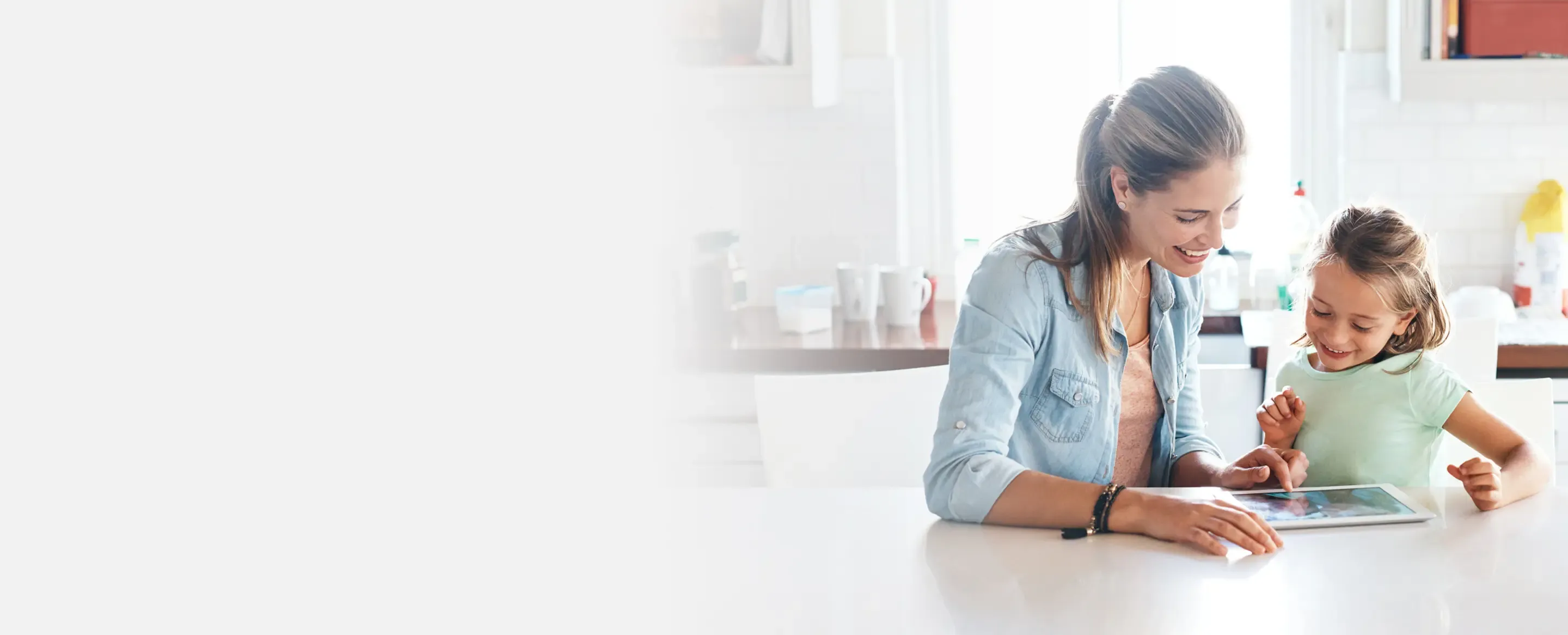 Mom and daughter using ipad